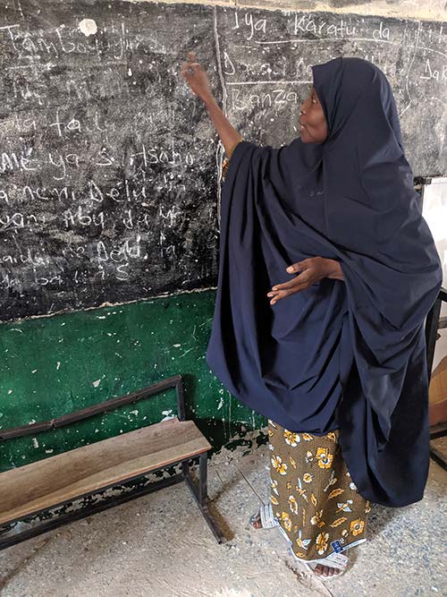 A teacher at a blackboard in Maiduguri, Northeast Nigeria